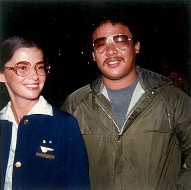 1970s  A friend of James Martinez poses for a photo with a Pan Am flight attendant at the airport on Guam.